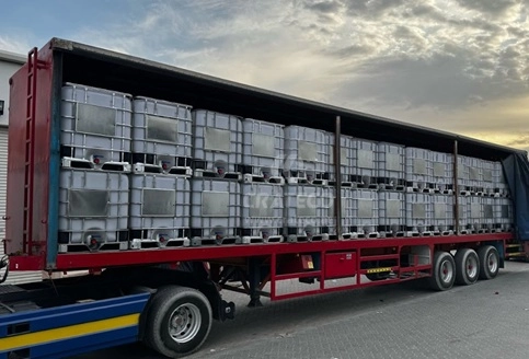 Close-up of Crateco IBC tank showing capacity markings, build, and valve detail