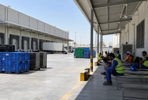 Shaded outdoor loading area at UAE warehouse following midday break rules for worker safety